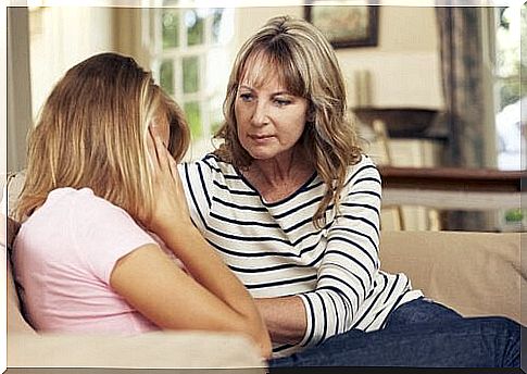 A mother comforts her daughter