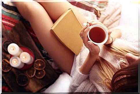 Woman drinking chamomile tea