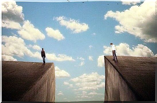 A big gap between two people standing on skyscrapers