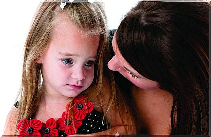 Girl being comforted by her mother as an example of childhood depression