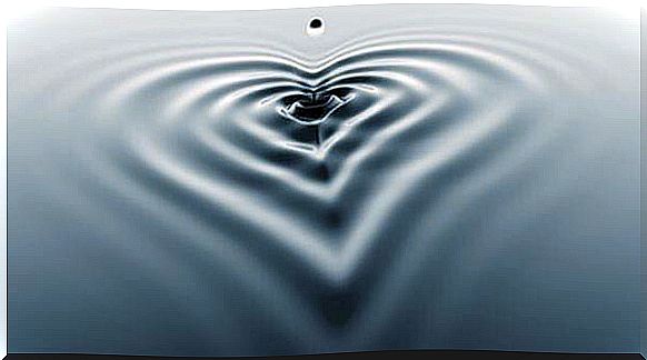 Water droplets form heart on water surface