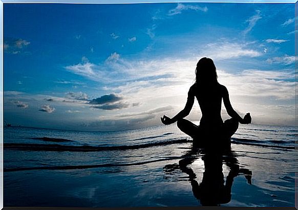 Woman meditates and practices mindfulness