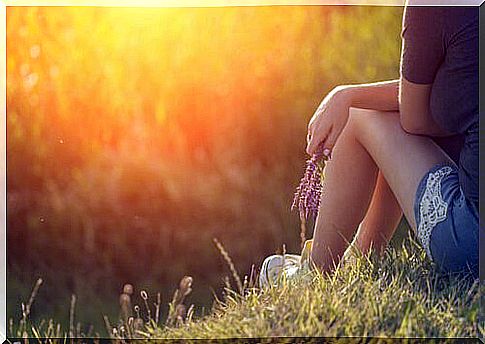 Woman Sitting in Grass