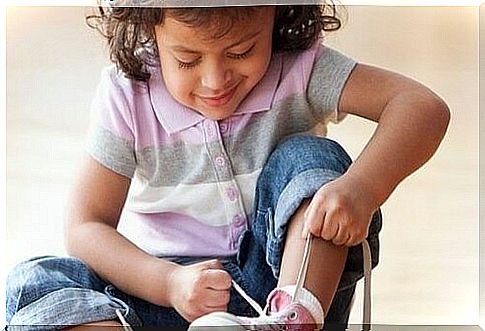 Girl tying her shoelaces