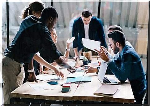 Colleagues in a meeting at the table