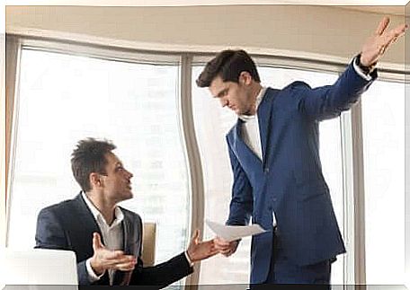 A disagreement between two men in the office